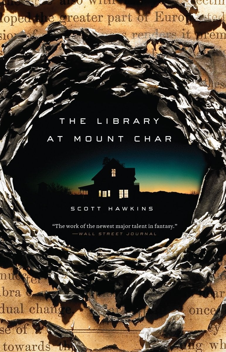 The Library at Mount Char by Scott Hawkins, a fiction book cover depicting a dark, window-lit ominous house silhouetted against a twilight sky sitting at the center of a swirling, gnarled wreath of branches with the title in white at the top, and the author's name at the bottom of the house.