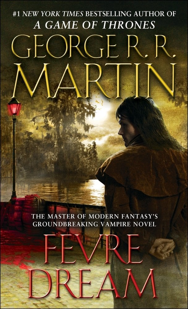 Fevre Dream by George R.R. Martin, a vampire fiction book cover depicting a man wearing an old-fashioned coat, standing in front of a watery background with trees and a single red lamplight.