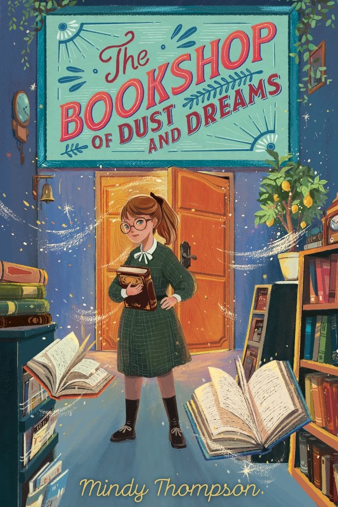 The Bookshop of Dust and Dreams by Mindy Thompson has a blue bookshop with a girl holding a book surrounded by shelves and books around her floating.