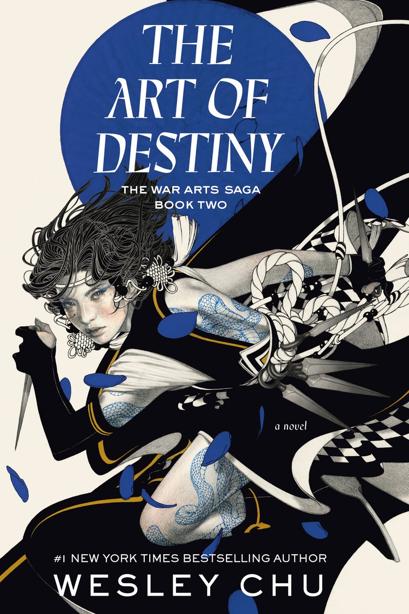 The Art of Destiny by Wesley Chu, a fantasy book cover depicting an illustrated woman warrior in running stance holding dagger-like weapon wearing intricate earrings, a headband, and an outfit with a cutout that shows the blue dragon tattoo that goes from her back all the way across her arm and down her leg. Blue petals fall in the forefront of the cover. The title text is capitalized and white with the background of a blue circle.