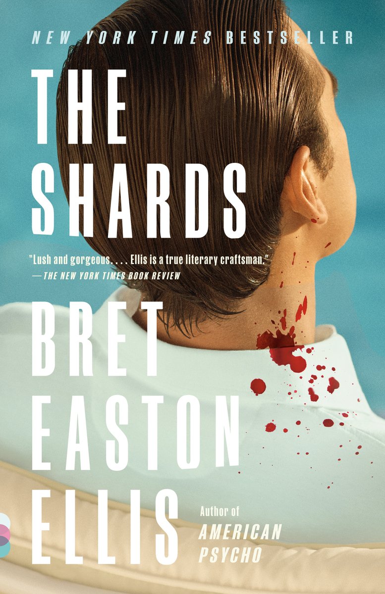 The Shards by Bret Easton Ellis. Depicted is the back of a man's head with combed wet hair in a white shirt. There's a splash of blood on his neck and collar.