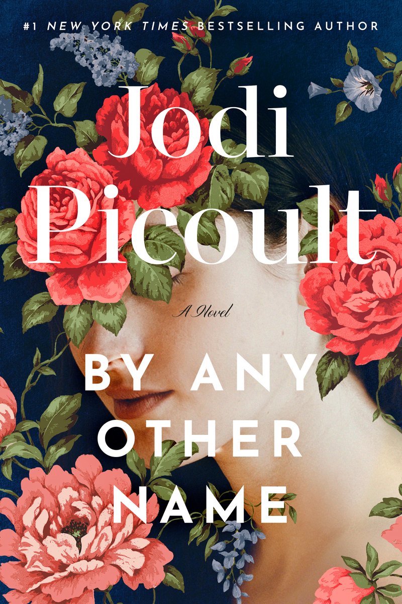 By Any Other Name by Jodi Picoult. Over a navy background, red and blue flowers obscure the eyes of a woman. Title and author text run across the center of the cover.