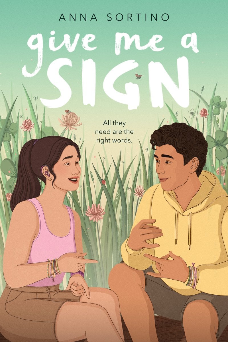 Give Me a Sign by Anna Sortino book cover. Lilah and Issac surrounding by pink flowers having a conversation in ASL.