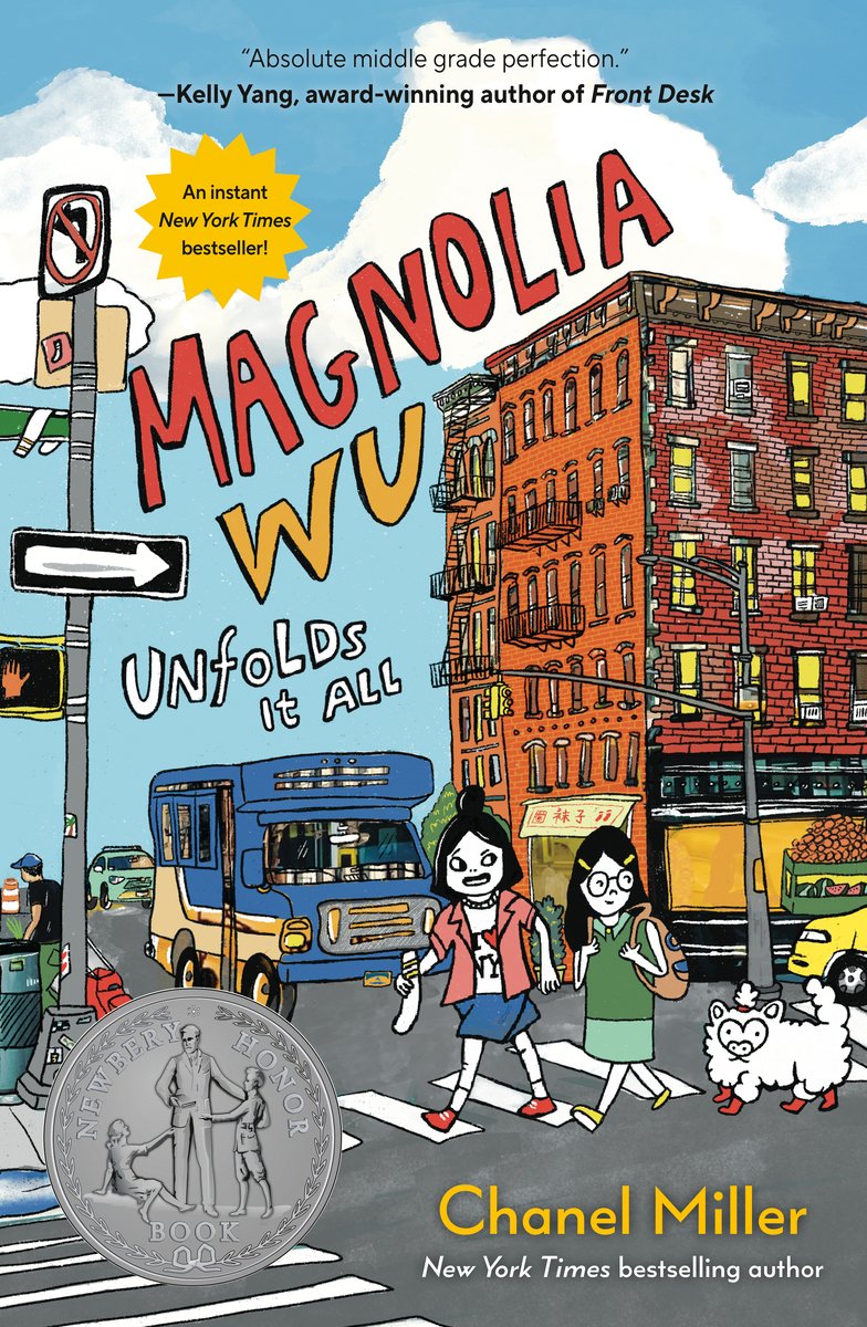 Magnolia Wu Unfolds It All by Chanel Miller, book cover. Two young girls and a fluffy, white animal are walking on a crosswalk intersection. Behind them is the busy environment of a city, filled with tall, brick buildings, traffic lights, buses, and other vehicles.