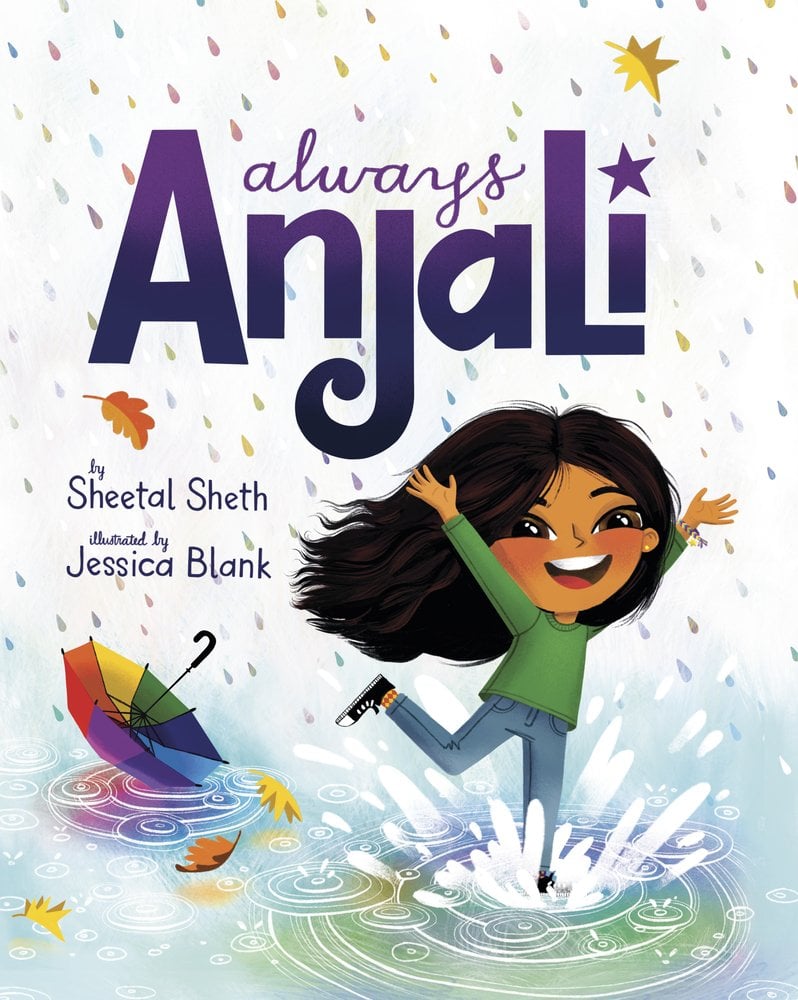 Book cover of Always Anjali by Sheetal Sheth, illustrated by Jessica Blank, featuring a brown-skinned child with long, dark wavy hair throwing her hands up as she jumps into a puddle; a rainbow umbrella rests upside-down in another puddle behind her.