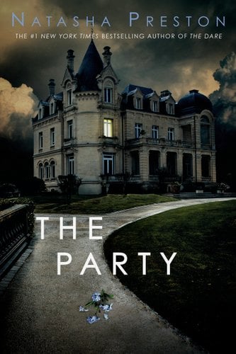 A grand gothic manor takes up most of the image. There is a sidewalk leading away from the house with blue flowers lying on it.