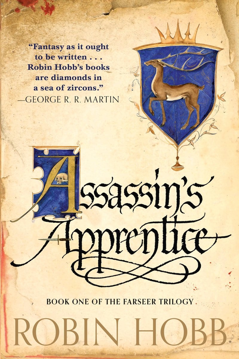 Assassin's Apprecntice by Robin Hobbs a fantasy book cover depicting a stag crest on a bloody piece of papyrus paper.