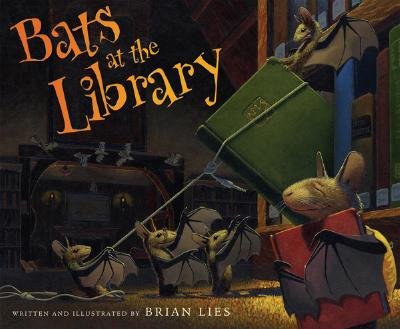 Bats at the Library by Brian Lies, book cover. A group of dark gray bats are pulling out a green book from the bookshelf in a library. One of the bats is hugging a red book.