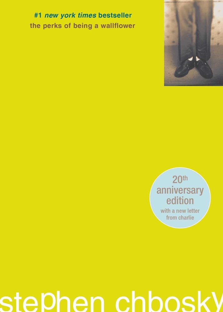 A yellow cover with a small black and white image in the top right corner. The title is in tiny brown letters at the top. The author's name is in large, white letters at the bottom.