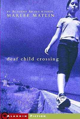 Book cover of "Deaf Child Crossing" with a young girl walking across a small ledge by the water and tall grass with purple coloring.