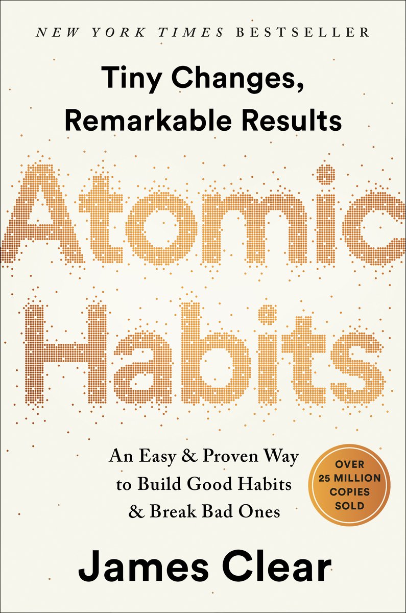 Atomic Habits by James Clear book cover depicting the title in gold with miniature dots spewing out.