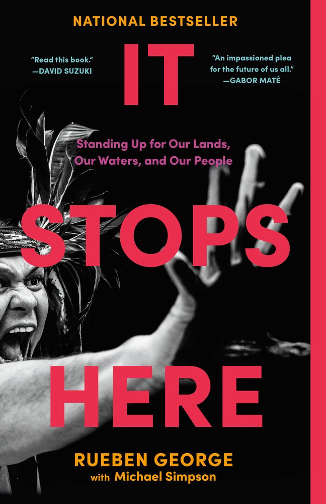 It Stops Here by Rueben George and Michael Simpson book cover depicting a person wearing a feather headdress with their hand extended in a "stop" motion with their mouth open in a scream against a black background.