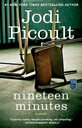 Nineteen Minutes by Jodi Picoult book cover. Two chairs are upside-down in a classroom.