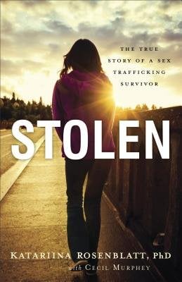 "Stolen: The True Story of a Sex Trafficking Survivor" book cover, with a woman walking down a sidewalk.