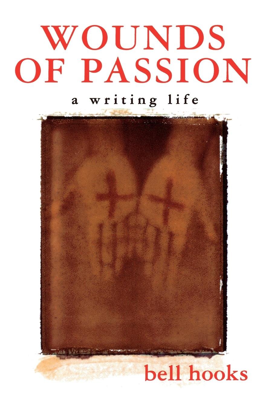 Words of Passion: A Writing Life by bell hooks, a memoir book cover depicting an old photograph of two hands bearing a red cross on both palms on a white background. The title and author's name are in red.