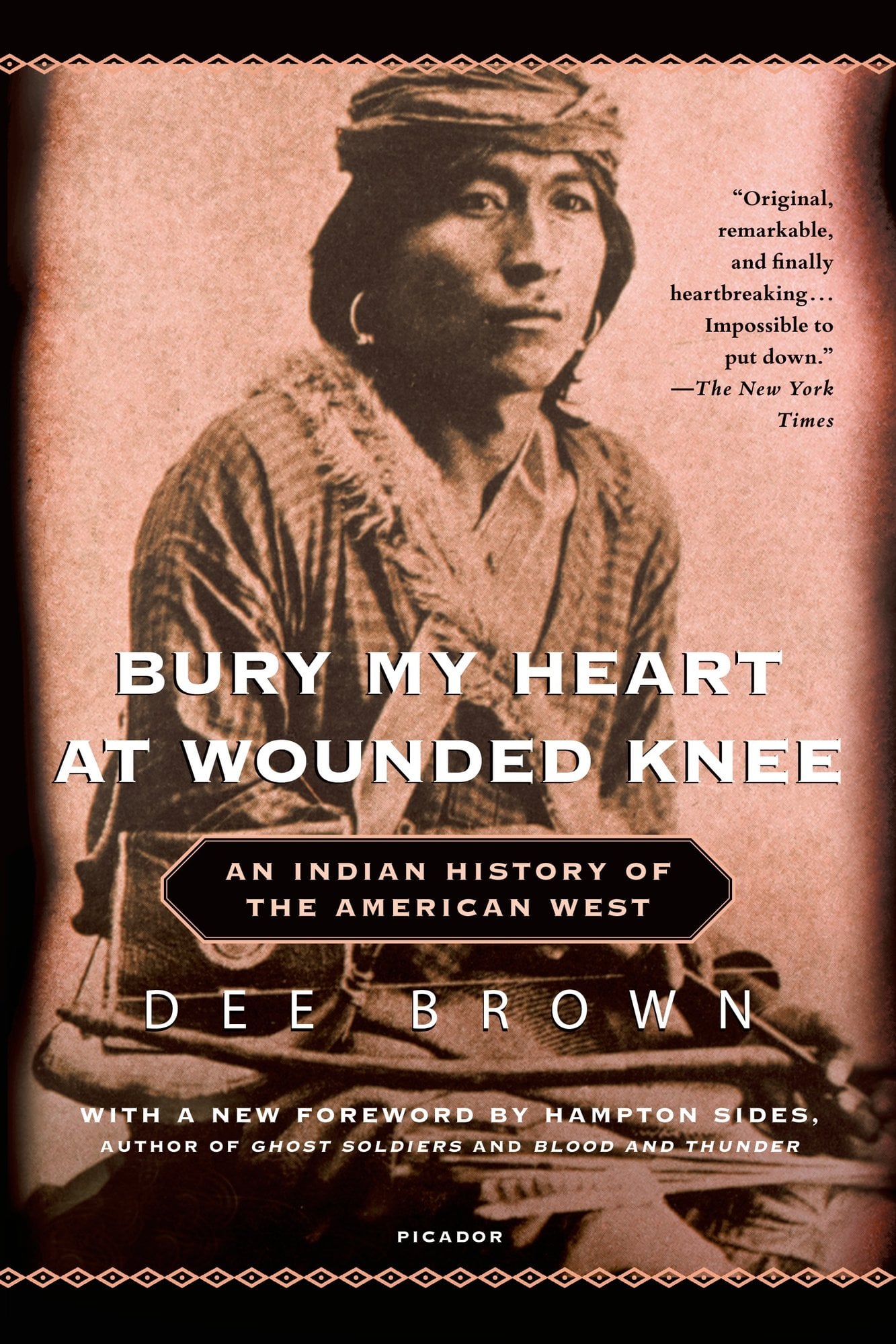 Bury My Heart at Wounded Knee: An Indian History of the American West by Dee Brown- a historical non-fiction book featuring an old photograph of an Indian American person.