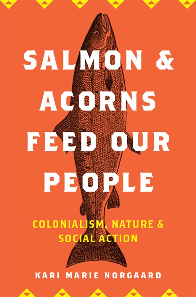 Salmon and Acorns Feed Our People: Colonialism, Nature, and Social Action by Kari Marie Norgaard book cover depicting a salmon on an orange background. There are yellow triangular markings on the top and bottom.