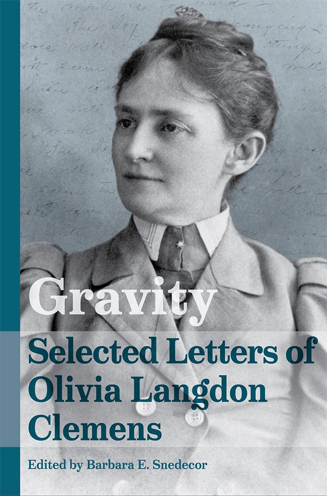 The book cover for Gravity: Selected Letters of Olivia Langdon Clemens, edited by Barbara E. Snedecor. A black and white photograph of Olivia Langdon Clemens wearing an old-fashioned suit dress and looking to the side. Behind her is a paper with faint cursive handwriting. The title is on the bottom in a translucent white rectangle with the text in white and dark teal.