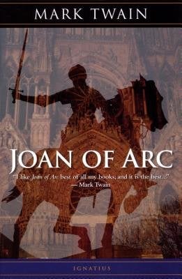 A background of elaborate, brown architecture that looks like the buildings of a castle, with the shadow of a man on a horse leaping up, and a sword in one hand. Big white text that reads "Joan of Arc," smaller text below that reads a quote by Mark Twain, and text at the top of the cover that reads "Mark Twain."