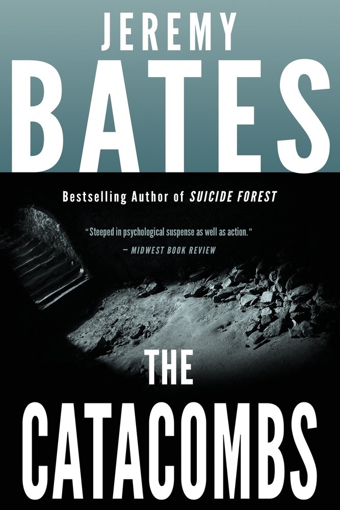 A darkened tunnel with stairs and dirt and rocks surrounded by pitch black. The title is at the bottom in large, white letters. The author's name is at the top in large, white letters.