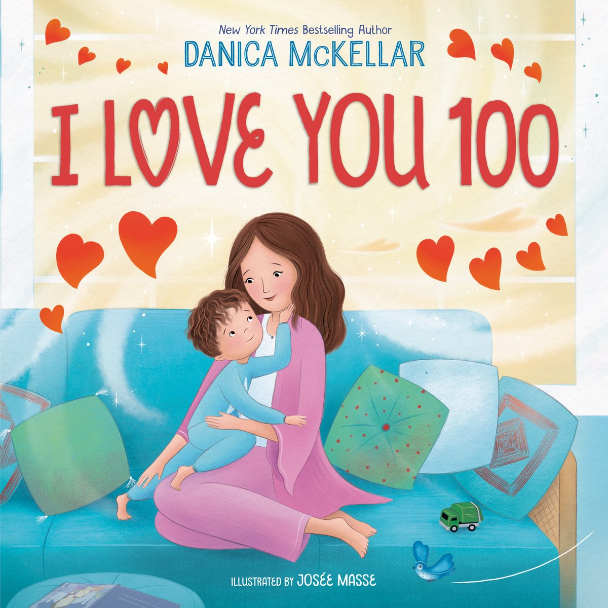 I Love You 100 book cover that shows a mom and son, embracing on a blue couch with green pillows. The couch is pressed against an open window that has a golden-like light coming through. The title is in red, all caps with the author's name in blue above that.