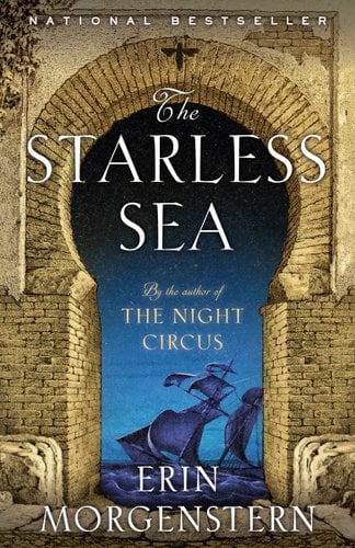 The Starless Sea by Erin Morgenstern book cover. Through a brick opening in a building in the shape of a keyhole is a ship with many sails sailing on a dark sea.