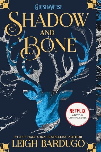 There's a blue stag with large antlers. The title is in yellow lettering at the top of the cover. The author's name is in yellow lettering at the bottom of the cover. The background is blackish blue with yellow, black, and blue pattering on the edges of the cover.