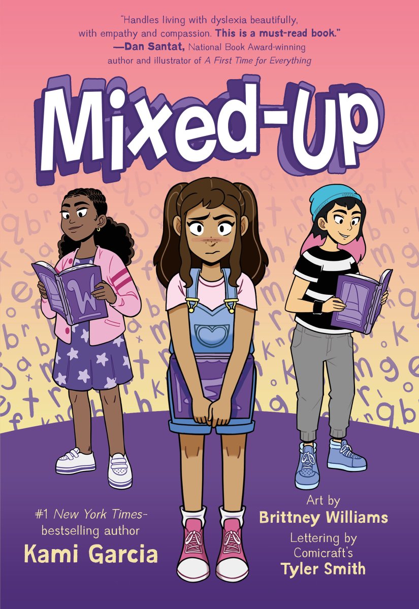 Book cover of Mixed-Up by Kami Garcia, with art by Brittney Williams and lettering by Tyler Smith, featuring a tan-skinned child with long brown hair in pigtails looking unsure while holding a book in front of their body; behind them are two more children, one brown-skinned with dark curly hair and one light-skinned with black and pink hair, confidently reading their own books; an assorted jumble of letters is also visible.