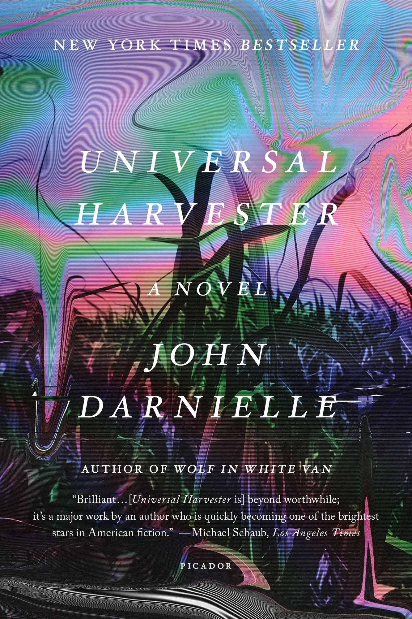 Book cover of 'Universal Harvester' by John Darnielle. A field of wheat is warped in radiant holographic patterns of pink, purple, blue, and green. The text is centered and in white.