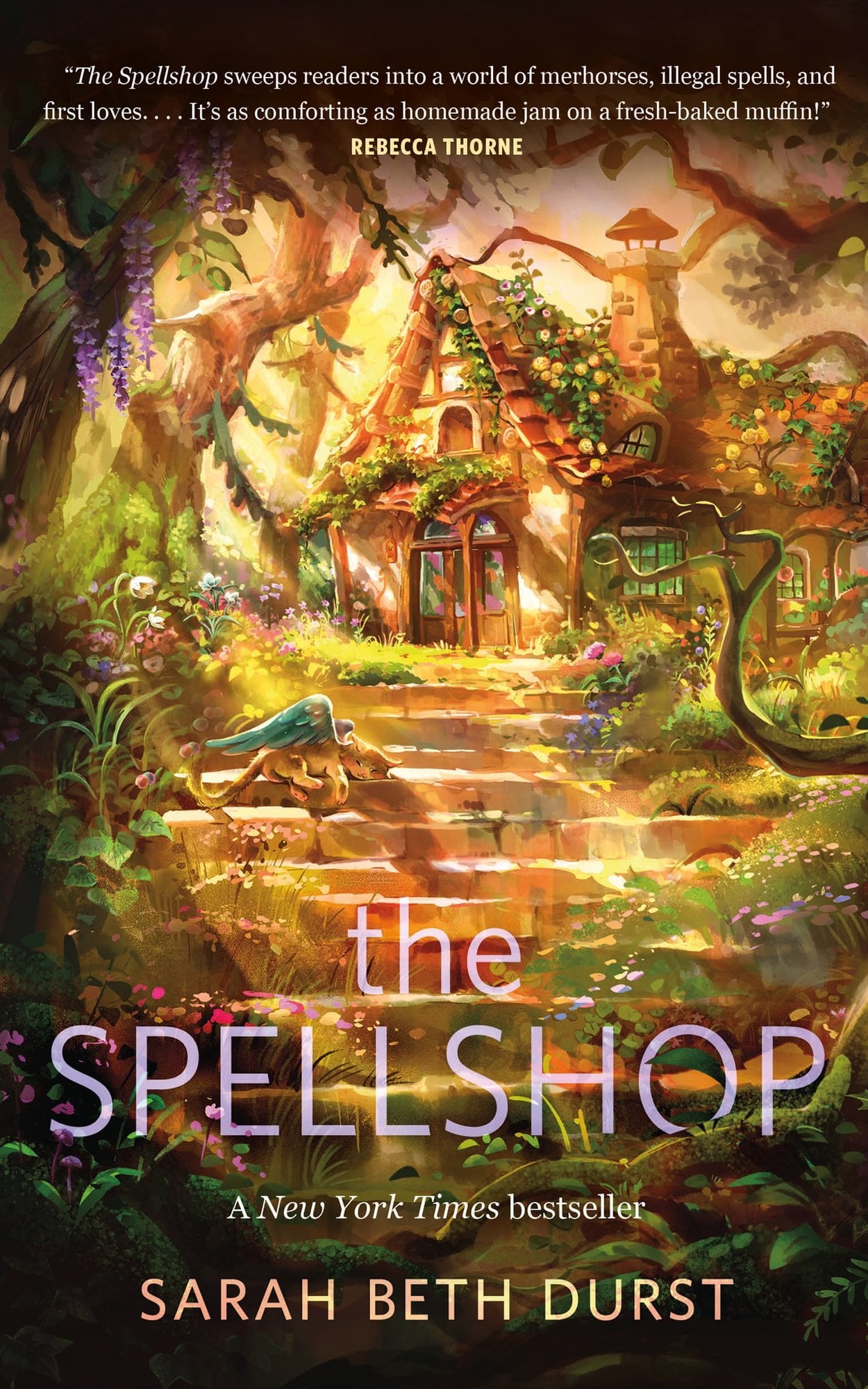Cover of The Spellshop by Sarah Beth Durst. There is a forest with stone steps leading up to a cottage. There is ivy on the house and a golden light shining on it.