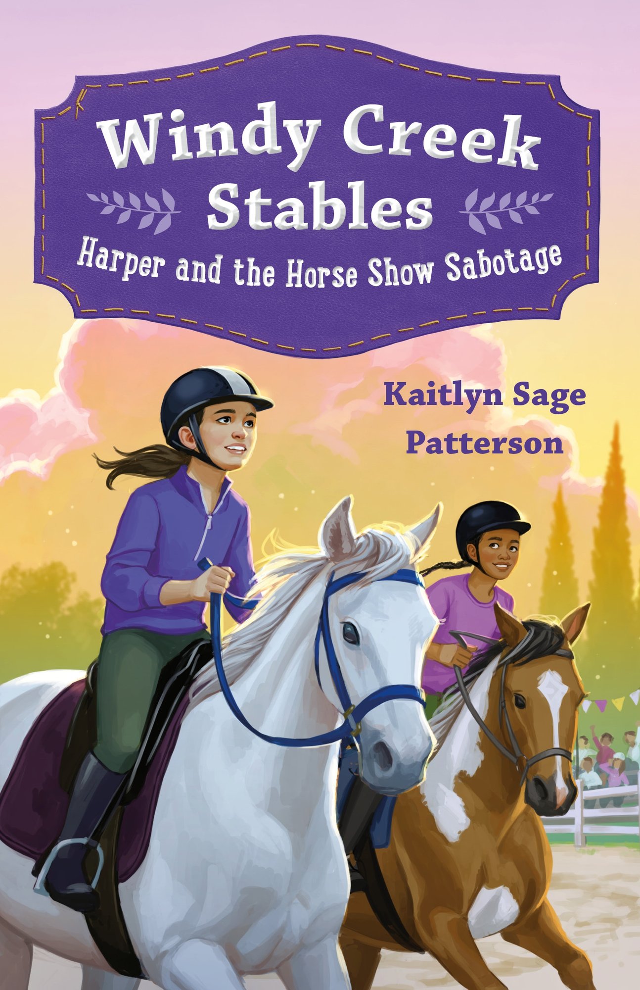 Windy Creek Stables book cover features a sunrise in the back ground as two girls on horses -- one white and one brown -- are riding with each other in a paddock. The title is in a purple, decorative book at the top with the author's name slightly to the bottom-right of that box.