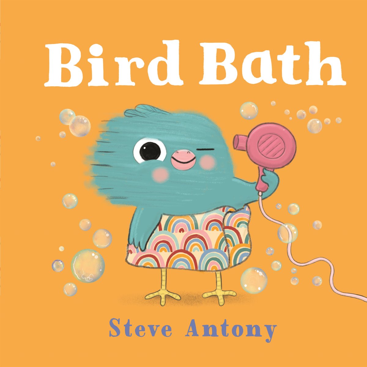 The book cover of Bird Bath by Steve Antony features a small blue bird wearing a rainbow-patterned towel around its waist and using a hairdryer to blow air on the side of its head.