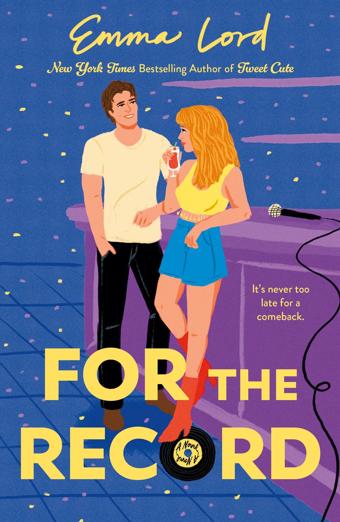 Book cover for For the Record by Emma Lord. Blue background with yellow and plum dots that resemble disco ball reflections. A man is leaning against a stage at a music venue with his hands in his pockets and looks at a woman sipping a cocktail who is looking in his eyes. A microphone lays on the stage behind the woman. The title text is yellow and capitalized. The "O" in record looks like a vinyl record.