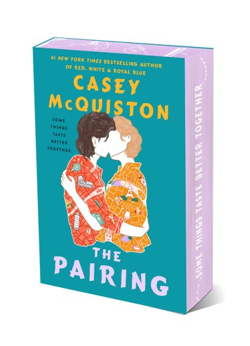 Book jacket for Casey McQuiston's The Pairing. Two silhouettes embrace in a kiss. Their shirts are decorated with maps, one orange and one yellow.