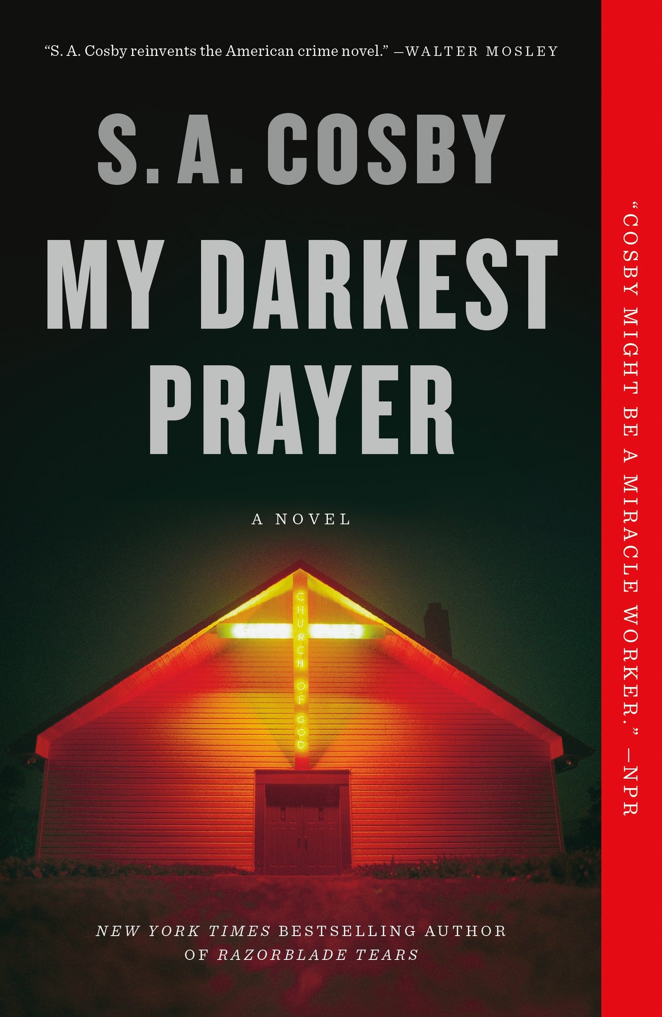My Darkest Prayer by S.A. Crosby, book cover. A church lit up by a giant red gross stuck to the front of it in a desolate field. The author's name is in a gray, with the title in a gray/off-white.