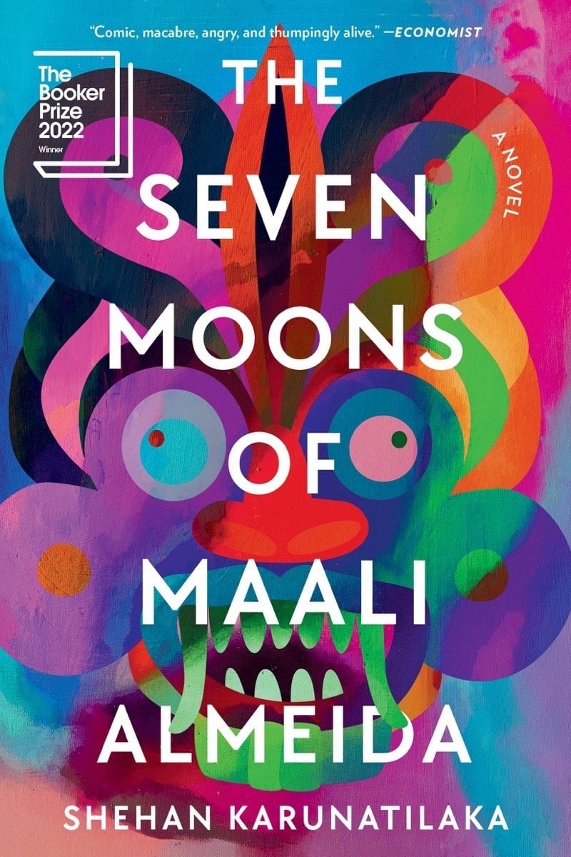 The Seven Moons of Maali Almeida by Shehan Karunatilaka, a Booker Prize 2022 Winner literary fiction novel featuring a vibrant abstract cover with swirling colors in blues, pinks, purples, and oranges creating a surreal artistic design.