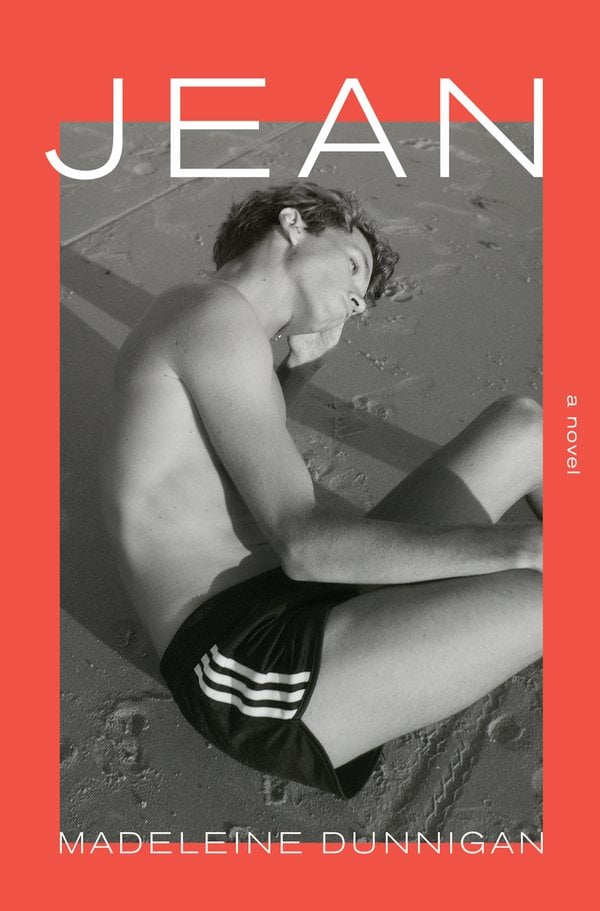 Jean by Madeleine Dunnigan book cover depicting a black and white image of a fair-skinned teenage boy wearing shorts sitting on the beach.