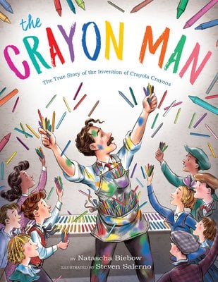 The Crayon Man by Natascha Biebow, illustrated by Steven Salerno, young man with colored overalls holding crayons, crayons up in the air, kids watching in awe holding crayons, book cover
