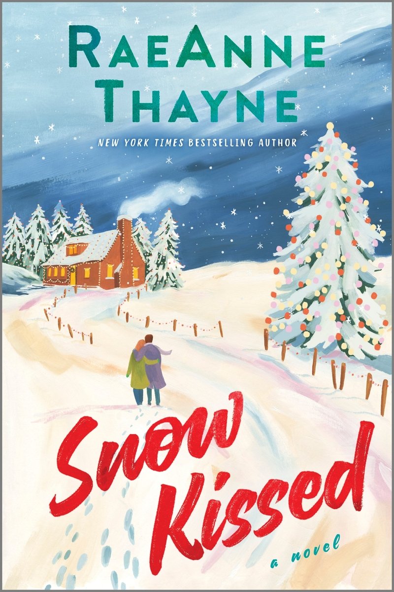 The book cover for Snow Kissed by RaeAnne Thayne. A winter landscape featuring snow covered roads, a dark blue sky, and a snowy pine tree decorated in yellow, pink, red, and white lights. A couple — one with orange hair and a green coat and the other with brown hair and a purple coat — embrace and walk towards a brown cabin in the distance. Behind the couple, their footprints can be seen in the snow.