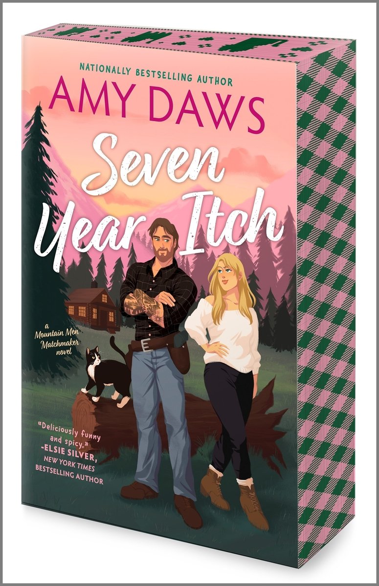 Seven Year Itch by Amy Daws book cover features a couple at a mountain retreat. They stand in front of a fallen log with a black and white tuxedo cat looking up at them on top of the log. The author's name is at the very top in bright pink text and the title is just below that and above the couple in written white script font. The sky is a soft pink like a sunset.