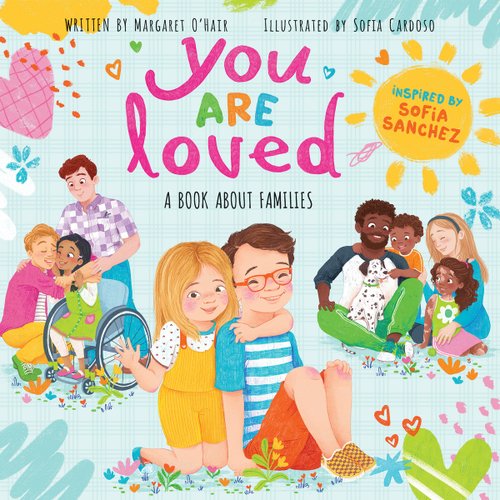 Different families from different backgrounds are showcased. They are all hugging each other. There are hearts, a sun, and colorful splatters across the foreground. The title sits in the top center in colorful letters. The author's name is at the top in small, black letters. Everything is set against a light blue background.