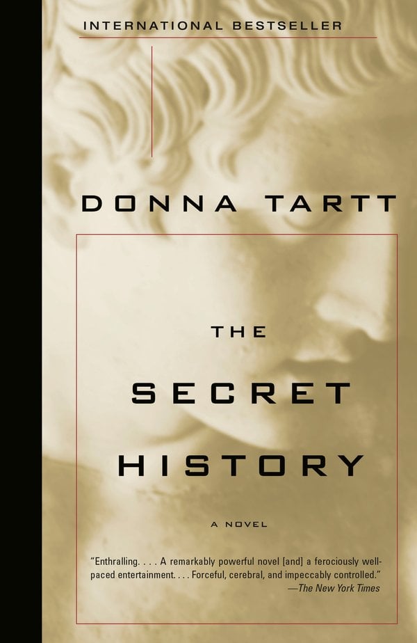 The Secret History by Donna Tartt, book cover. With a beige background, a side portrait of a Greek statue male figure's face takes up the entire cover.
