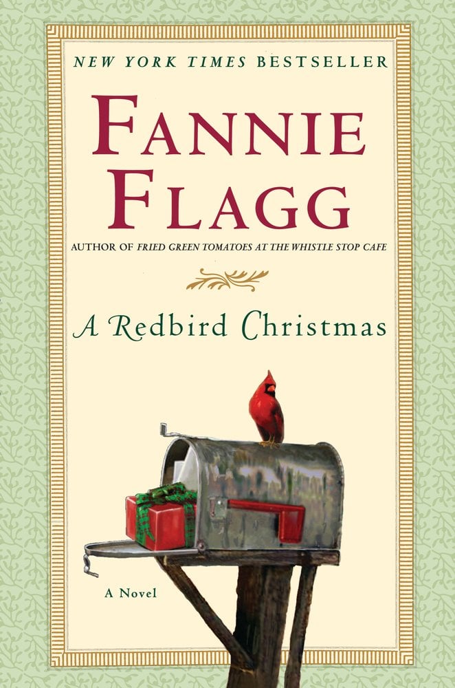 A Redbird Christmas by Fannie Flagg, a fiction book cover depicting an open gray mailbox with a red present with a green bow inside. On top of the mailbox is a small red bird with an orange beak. The cover also has a thick and decorative light green border.