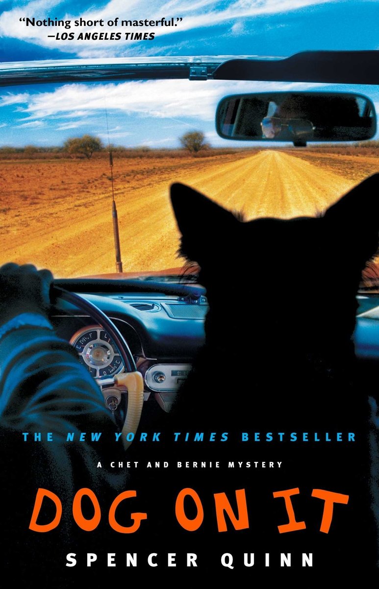 Dog On It by Spencer Quinn shows a dog in the passenger seat of a convertible with the arm of the man driving showing as he drives.