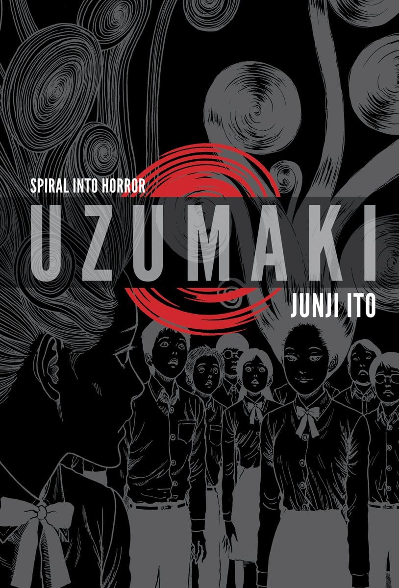 Uzumaki by Junji Ito, depicting two girls looking at each other with wild hair that is locked in spirals.