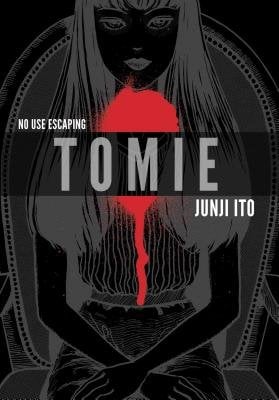 Manga cover of Tomie by Junji Ito. Dark cover shows outline of a girl and a red blotch underneath her face and between her shoulders.