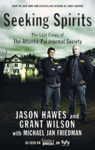 Two men stand off to the right side of the cover. There's a house in the background that looks as if no lights are shining in any of the windows. A ghostly figure stands behind the guys but in front of the house. The title is in large black lettering above the two men's heads. The authors' names are below the two men in medium lettering.