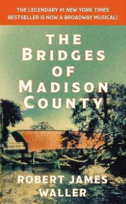 The Bridges of Madison County by Robert Waller James. Bold white title and author text is visible over an image of a covered bridge, with an orange banner at the top of the cover.