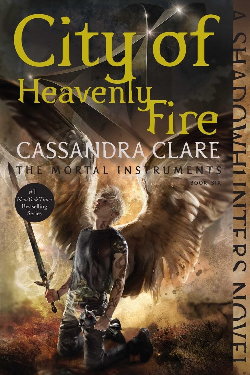 City of Heavenly Fire by Cassandra Clare a YA Fantasy Book cover depicting a man in angel wings holding a sword while looking up.