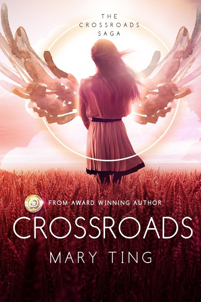 Crossroads by Mary Ting, a fiction book cover showing a glowing pair of angel wings unfolding behind a young woman standing in a sunlit field of tall grasses, the sky blending from soft shades of pink under the bold white title and the author's name written in white below.